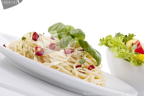 Image of fresh pasta with chilli and basil isolated