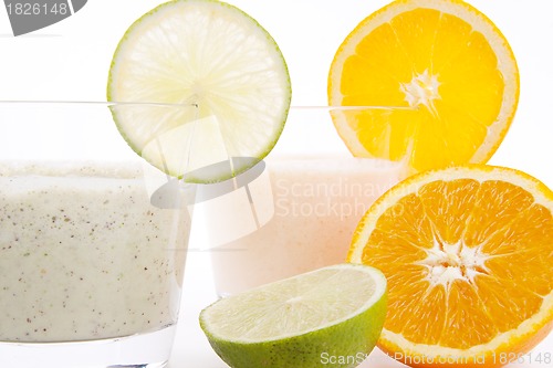 Image of fresh tasty lime and orange yoghurt shake cream isolated