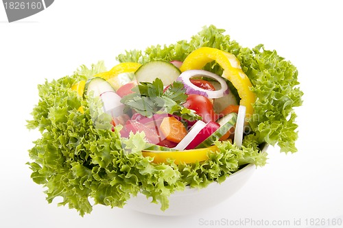 Image of fresh tasty mixed salad with different vegetables isolated