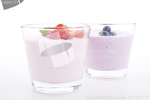 Image of fresh tasty strawberry blueberry yoghurt shake cream isolated