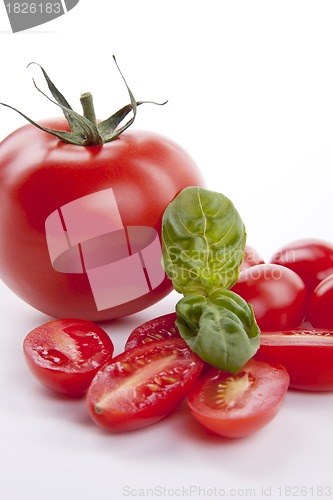 Image of fresh red tomatoes with balsamic and oilve oil isolated