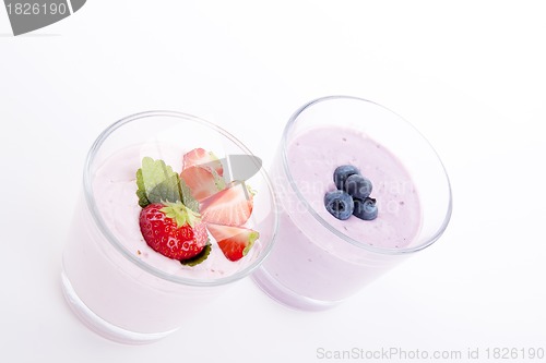 Image of fresh tasty strawberry blueberry yoghurt shake cream isolated