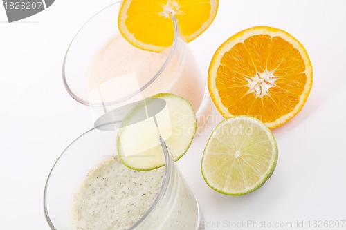 Image of fresh tasty lime and orange yoghurt shake cream isolated