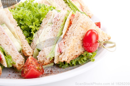 Image of fresh tasty club sandwich with salad and toast isolated