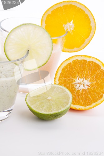 Image of fresh tasty lime and orange yoghurt shake cream isolated