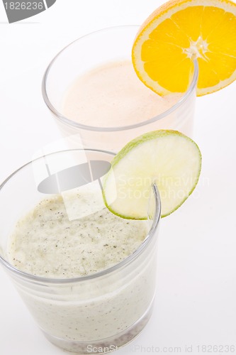 Image of fresh tasty lime and orange yoghurt shake cream isolated