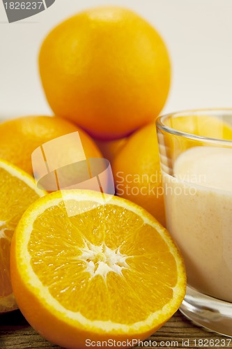 Image of fresh tropical orange yoghurt shake dessert on table