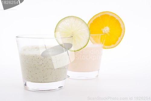 Image of fresh tasty lime and orange yoghurt shake cream isolated