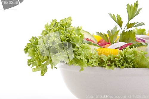 Image of fresh tasty mixed salad with different vegetables isolated