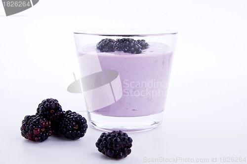 Image of fresh tasty blackberry yoghurt shake dessert isolated