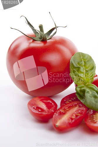 Image of fresh red tomatoes with balsamic and oilve oil isolated