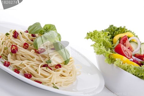 Image of fresh pasta with chilli and basil isolated