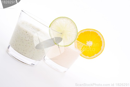Image of fresh tasty lime and orange yoghurt shake cream isolated