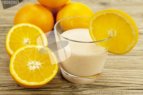 Image of fresh tropical orange yoghurt shake dessert on table