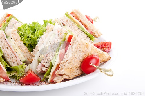 Image of fresh tasty club sandwich with salad and toast isolated