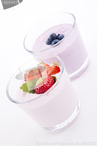 Image of fresh tasty strawberry blueberry yoghurt shake cream isolated