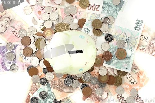 Image of coin bank and czech money