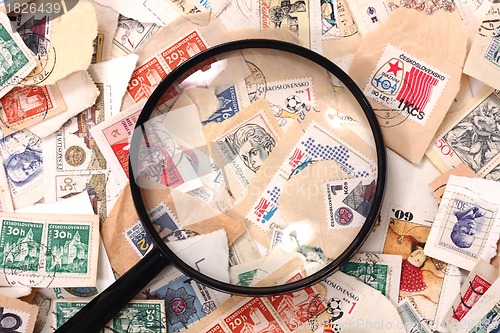 Image of postage stamp and magnify glass