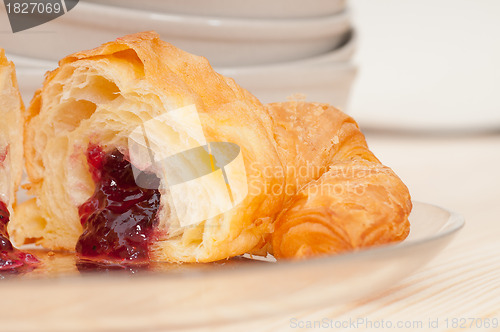 Image of croissant French brioche filled with berries jam