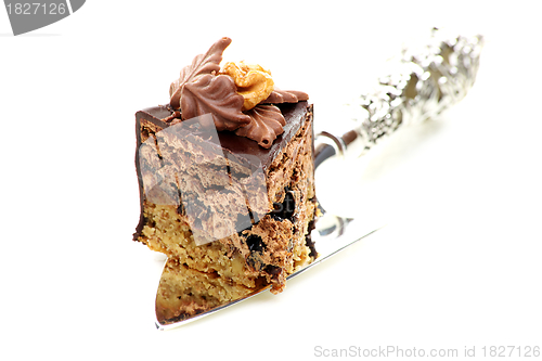 Image of Piece of chocolate cake with prunes. 