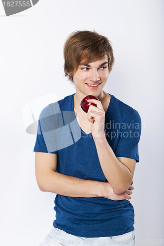 Image of Young man with a apple