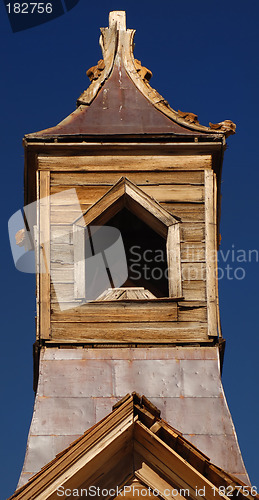 Image of Old wooden church steeple against a deep blue sky