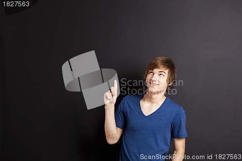 Image of Young man over a chalk board