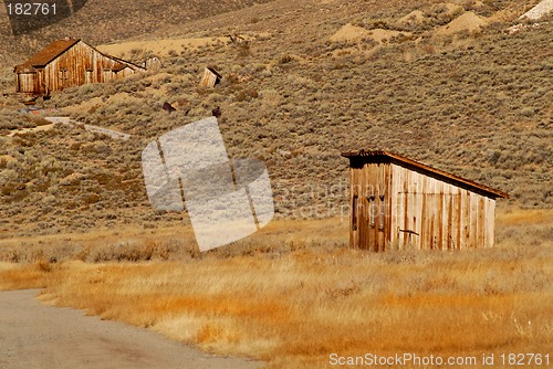 Image of Two deserted wooden structures in old mining town