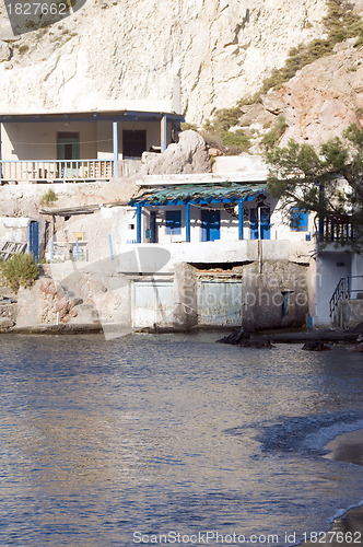 Image of fisherman houses built into rock cliffs  Mediterranean Sea Firop