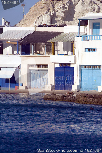 Image of fisherman houses built into rock cliffs  Mediterranean Sea Firop