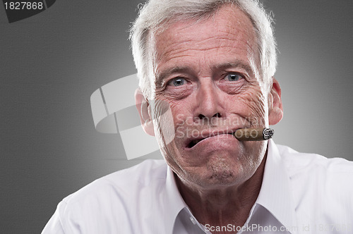 Image of Puzzled senior man on gray background