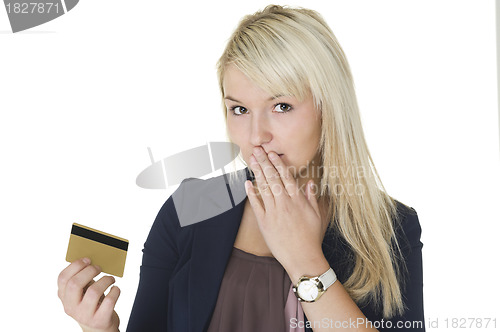 Image of Woman with guilty look holding credit card