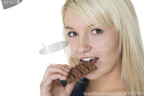 Image of Attractive woman eating chocolate