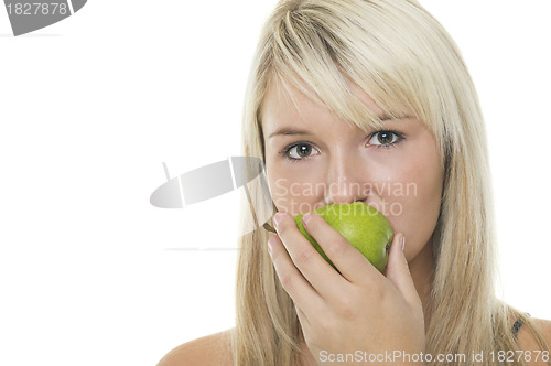 Image of Woman eating a green pear