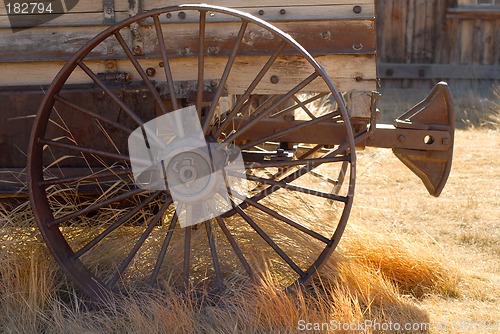 Image of Old weathered wagon with rusted wheel