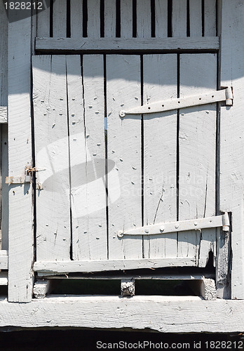 Image of Old white wooden barn door