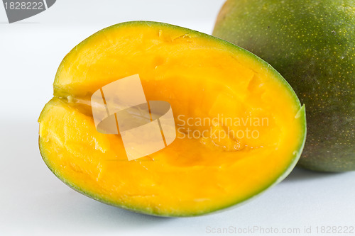 Image of Two mangoes on white background