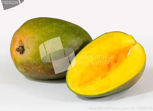 Image of Two mangoes on white background