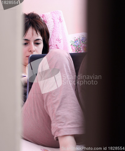 Image of Young woman with laptop 