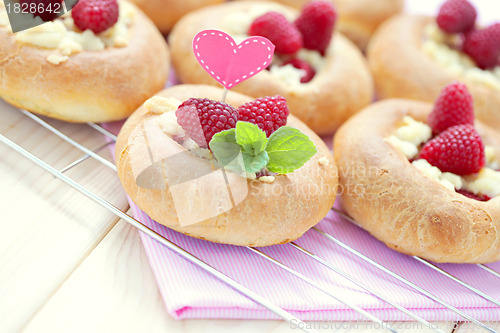 Image of buns with raspberries