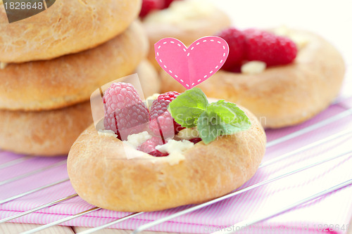 Image of buns with raspberries