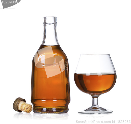 Image of Cognac brandy bottle and glass isolated on white background