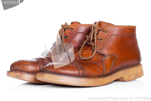 Image of Red old leather boots isolated on white background