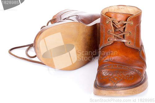 Image of Red old leather boots isolated on white background