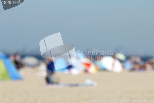 Image of blur background : people relaxing on the beach