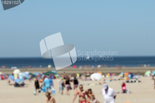 Image of blur background : people relaxing on the beach