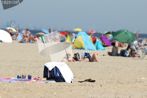 Image of people relaxing on the beach