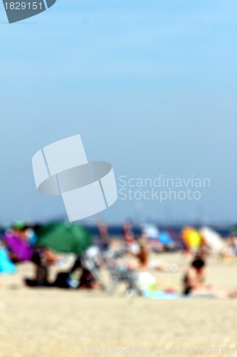 Image of blur background : people relaxing on the beach