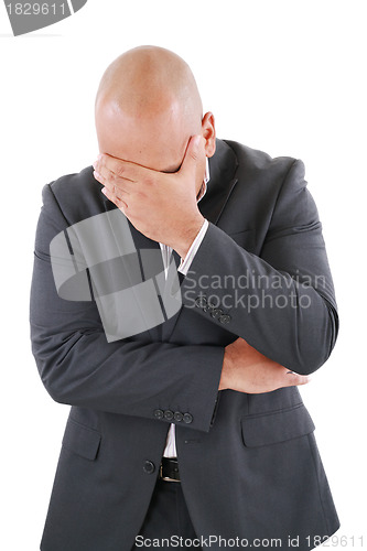 Image of Portrait of a young business man looking depressed from work iso