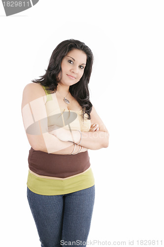 Image of Portrait of an attractive young woman standing with her hand fol